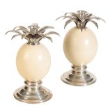 A PAIR OF OSTRICH EGG AND SILVER CANDLESTICKS