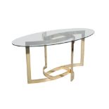 AN OVAL GLASS TOPPED COFFEE TABLE