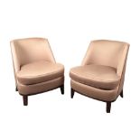 A PAIR OF CUSHIONED LOUNGE CHAIRS