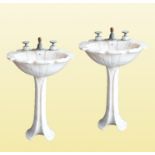 SHERLE WAGNER INTERNATIONAL: A PAIR OF ROSE AURORA MARBLE 'TULIP' PEDESTAL SINKS