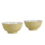 PAIR OF YELLOW-GROUND INCISED 'DRAGON' BOWLS, KANGXI SIX CHARACTER MARK AND OF THE PERIOD