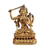 GILT BRONZE FIGURE OF SHADAKSHARI LOKESHVARA, YIGE DRUGMA