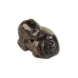 SMALL RUSSET JADE CARVING OF A LION, MING DYNASTY