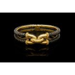 A VINTAGE BOUCHERON PARIS BRONZE AIRAIN AND 18CT YELLOW GOLD BANGLE