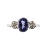 A TANZANITE AND DIAMOND THREE STONE RING