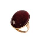 A RED AMBER DRESS RING,