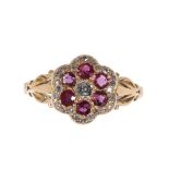 A RUBY AND DIAMOND FLOWER HEAD RING