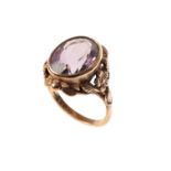 AN AMETHYST DRESS RING,