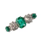 A FIVE STONE EMERALD AND DIAMOND RING