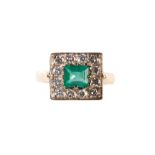 AN EMERALD AND DIAMOND CLUSTER RING