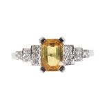 AN ART DECO STYLE YELLOW SAPPHIRE AND DIAMOND RING