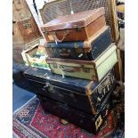 A JAPANNED TIN TRUNK, a canvas travelling trunk and three suitcases