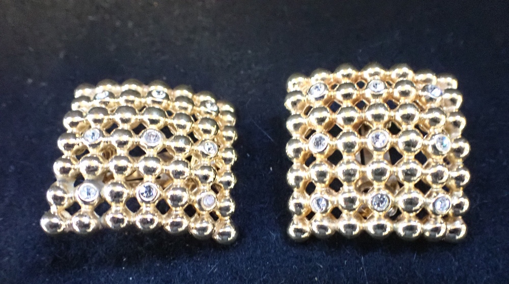 CHRISTIAN DIOR, a pair of yellow metal and paste earrings, of pierced square form