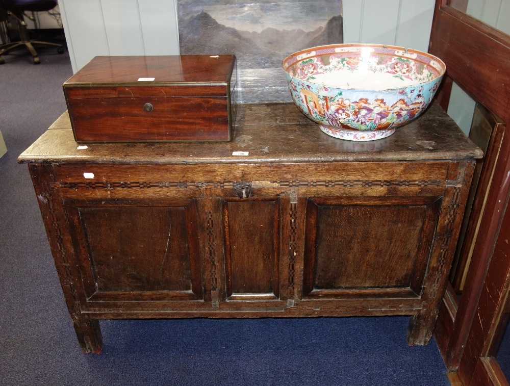 A 17TH CENTURY OAK PANELLED COFFER with marquetry decoration to the front and heart shaped iron