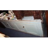 A PAINTED PINE FOUR DOOR CUPBOARD of long low proportions, 215cm wide
