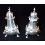 A PAIR OF SILVER CASTERS, retailed by Maple & Co, London, 10cm high (c.6.2oz) (2)