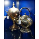 A SILVER PLATED TEA URN with cast and pierced decoration and a similar spirit kettle on stand