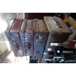 A VINTAGE LEATHER SUITCASE, two others and a canvas covered trunk