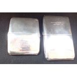 A SILVER CIGARETTE CASE, with engraved presentation inscription, and one other (c.10.9oz) (2)