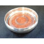 A SILVER COASTER, 13.5cm dia approx