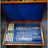 AN EDWARDIAN CANTEEN OF CUTLERY in a fitted mahogany case