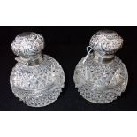 A PAIR OF SILVER MOUNTED AND CUT-GLASS SCENT BOTTLES, by George Unite, Birmingham, 10cm high