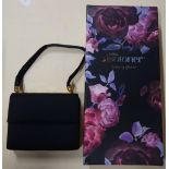 A BLACK FABRIC EVENING COMPACT BAG, together with a pair of totes 'isotoner' suede luxury gloves