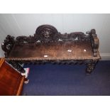 A VICTORIAN CARVED OAK HALL BENCH, 120cm long