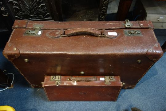 A VINTAGE LEATHER SUITCASE AND A MASONIC REGALIA CASE