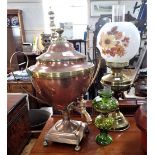 A REGENCY COPPER TEA URN and two oil lamps