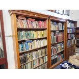 A PAIR OF PINE OPEN BOOKCASES WITH ADJUSTABLE SHELVES, each 125cm wide x 205cm high and a 1930s