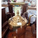 A LARGE BRASS KETTLE
