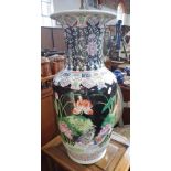A LARGE FAMILLE NOIR VASE decorated with peonies and insects, 62cm high