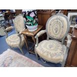 A PAIR OF CARVED, PAINTED AND UPHOLSTERED FAUTEUILS IN LOUIS XVI STYLE, first half 20th century,