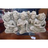 A RECONSTITUTED SANDSTONE SCENE OF FIVE SEATED FIGURES ON A STAND taken from the original on the