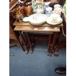 AN EDWARDIAN MAHOGANY NEST OF THREE TABLES