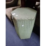 A LLOYD LOOM BY LUSTY & SONS LTD green painted hexagonal laundry basket (labelled)