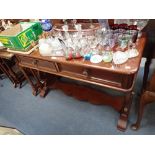 A VICTORIAN MAHOGANY WASH STAND ON lyre shaped supports, fitted two drawers, 112cm wide