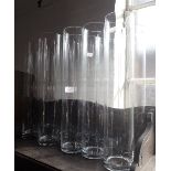 A SET OF TEN CONTEMPORARY GLASS CYLINDER VASES, ideal for a wedding, each 50cm high x 10cm dia.