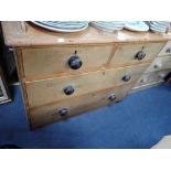 A VICTORIAN STRIPPED PINE CHEST OF DRAWERS with ebonised knobs and raised back stand, 98cm wide