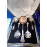 A SET OF SILVER PLATED SPOONS in fitted case