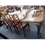 AN EDWARDIAN QUEEN ANNE REVIVAL DINING TABLE with four chairs