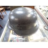 A NAZI HELMET stamped ET68 (with some touched-in paintwork)