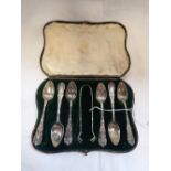A CASED SET OF SIX SILVER TEASPOONS AND SUGAR TONGS, in fitted case, (2.6oz)