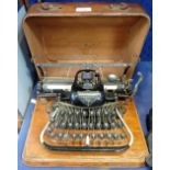 AN EARLY 20TH CENTURY 'BLICKENSDERFER' TYPEWRITER (pre Qwerty) with oak case