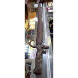 A FRENCH CHASSEPOT BAYONET with brass ribbed handle and original metal scabbard M1866 70 cm long