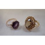 A GEM-SET DRESS RING on a yellow gold shank and one other similar ring, both ring size M