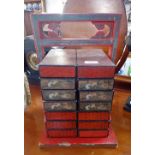 A CHINESE RED LACQUER FOOD CARRIER with many containers with framework, 40cm high