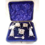 A CASED SILVER CONDIMENT SET (c.6.4oz)