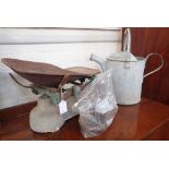 A VINTAGE GALVANIZED WATERING CAN and a set of scales with weights